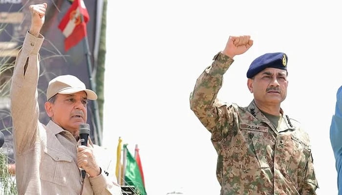 Prime Minister Shehbaz Sharif and Chief of Army Staff (COAS) General Asim Munir gesture in this image taken on their visit to meet members of the armed forces who took part in Operation Bunyan-um-Marsoos against India. — Instagram/shehbazsharif