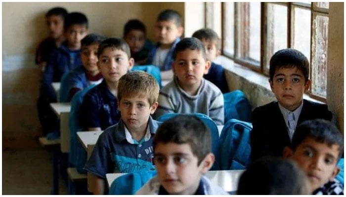 This representational image shows school children sit in a classroom in a school. — Reuters/File