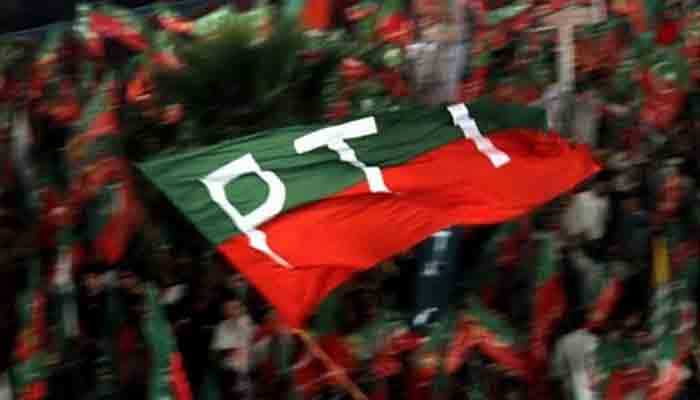 A representational image showing a PTI flag being waved during a public rally. — PPI/File