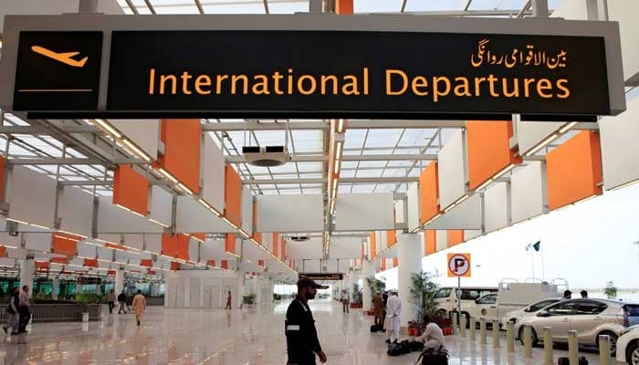 A worker walks at the departure area of the newly built Islamabad International Airport. — Reuters/File