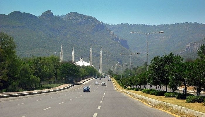 The image displays the Faisal Mosque in Islamabad, Pakistan, situated at the foothills of the Margalla Hills. — The News/File