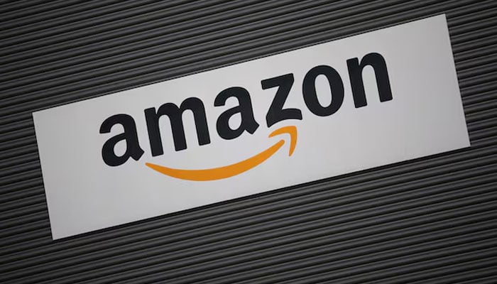 Amazon logo outside an Amazon warehouse in Manchester, Britain, October 28, 2025.—Reuters
