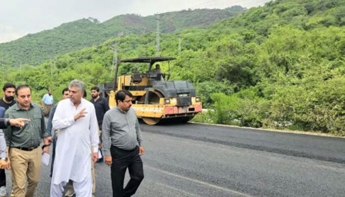 This representational photo shows officials inspecting development work. — APP/File