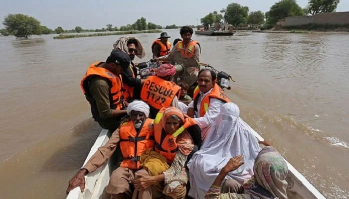 Flood-affected people are being evacuated from a flooded area in Bahawalnagar of Punjab province on August 26, 2023. —AFP