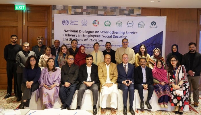 The image is a group photo of participants of a national dialogue organised by the International Labour Organization (ILO) and the Health Services Academy (HSA) on December 2, 2025. — Facebook@healthservicesacademy