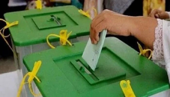 This undated image shows a woman casting vote in ballot box. — AFP/File