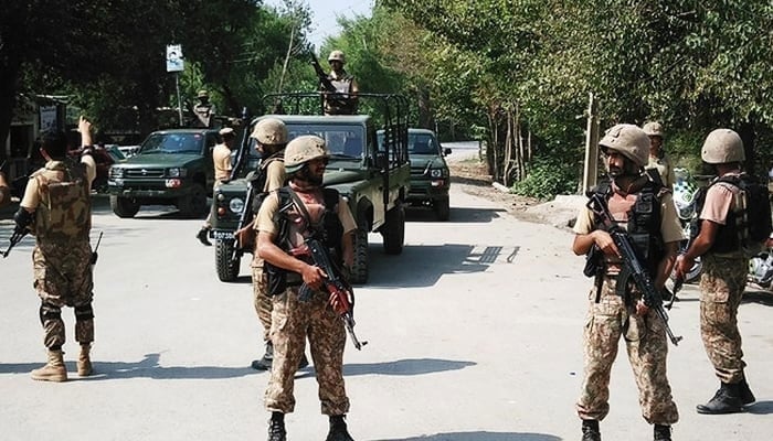 In this representational file photo, Pakistan Army soldiers cordon off a street leading to the outskirts of Peshawar on September 2, 2016. — AFP