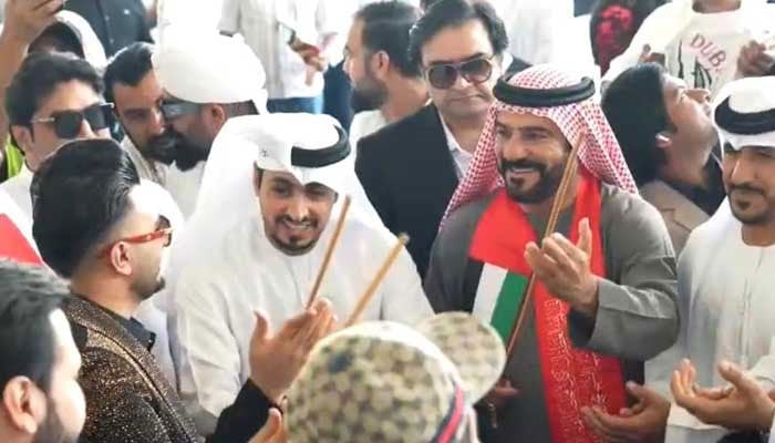 People attend UAEs 54th National Day. — Reporter/ sibt-e-Arif