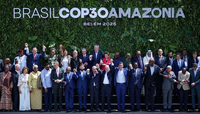 Brazils President Luiz Inacio Lula da Silva, United Nations Secretary-General Antonio Guterres and other delegates attending the Belem Climate Summit ahead of the United Nations Climate Change Conference (COP30) raise hands as they pose for a family photo, in Belem, Brazil, November 7, 2025. — Reuters