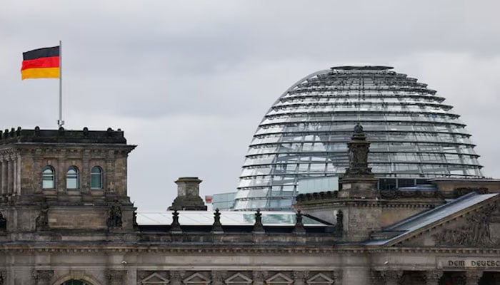 The German flag flutters outside the Reichstag building, the seat of the German parliament, the Bundestag, in Berlin, Germany, September 16, 2025.—Reuters