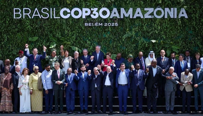 Brazils President Luiz Inacio Lula da Silva, United Nations Secretary-General Antonio Guterres and other delegates attending the Belem Climate Summit ahead of the United Nations Climate Change Conference (COP30) raise hands as they pose for a family photo, in Belem, Brazil, November 7, 2025. — Reuters