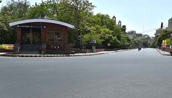 A deserted view of GPO Chowk, Mall Road in Lahore. — APP/File