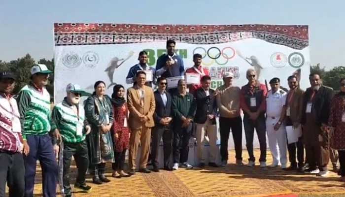 WAPDAs Arshad Nadeem (centre) poses at the podium after winning the gold medal in mens Javelin throw at the 35th National Games in Karachi on December 8, 2025. — X/@Muneeb313_