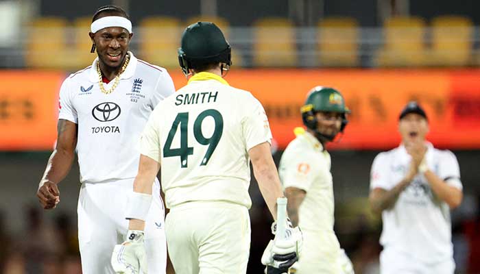 Englands Jofra Archer interacts with Australias Steve Smith, The Ashes - Australia v England - Second Test - The Gabba, Brisbane, Australia - December 7, 2025. — Reuters