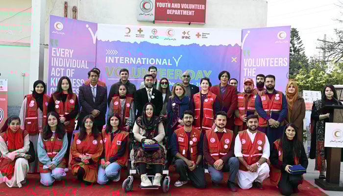Volunteers pose for a photo during International Volunteer Day celebrations at the PRCS National Headquarters on December 5, 2025. — APP