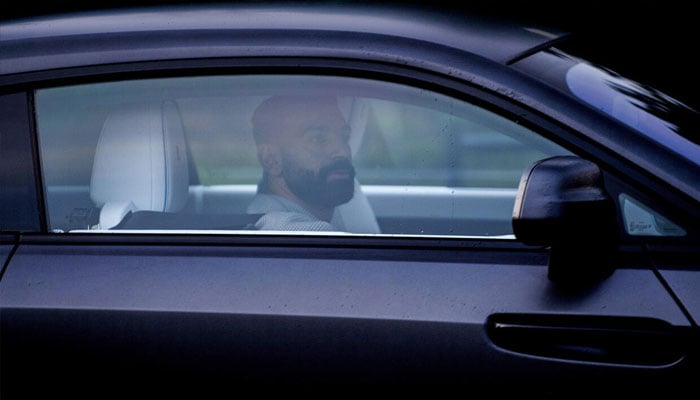 Liverpool striker Mohamed Salah arriving at the clubs training ground while his teammates were in Milan. —AFP/File