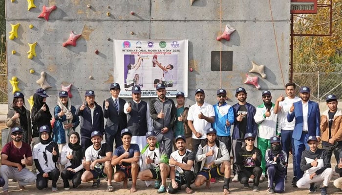 Participants pose for a group photo during a Sport Climbing event at the Climbing Wall, Pakistan Sports Complex, Islamabad, on December 9, 2025. — Facebook@PakistanSportsBoard