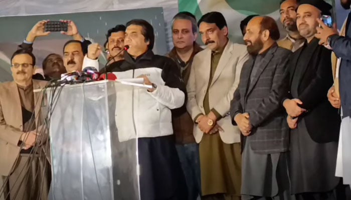 Federal Minister for Railways, Hanif Abbasi, as the chief guest, addresses a ceremony organised by Anjuman-e-Tajraan at Commercial Market, to pay tribute to the Pakistan armed forces’ sacrifices on December 9, 2025. — Screengrab via Facebook@hanifabbasiNA56