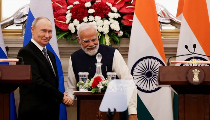 Russian President Vladimir Putin and Indias Prime Minister Narendra Modi shake hands as they attend a presentation of a joint statement after their delegation level talks at Hyderabad House in New Delhi, India, December 5, 2025.—Reuters