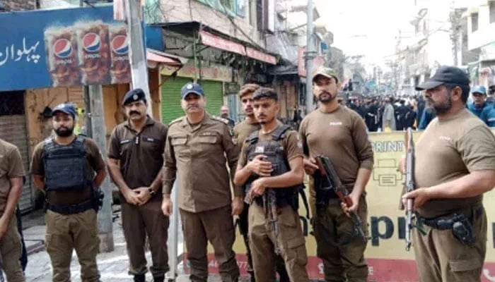 Punjab police personnel standing guard on the road on August 26, 2024. — Facebook@PunjabPolicePakistanOfficial