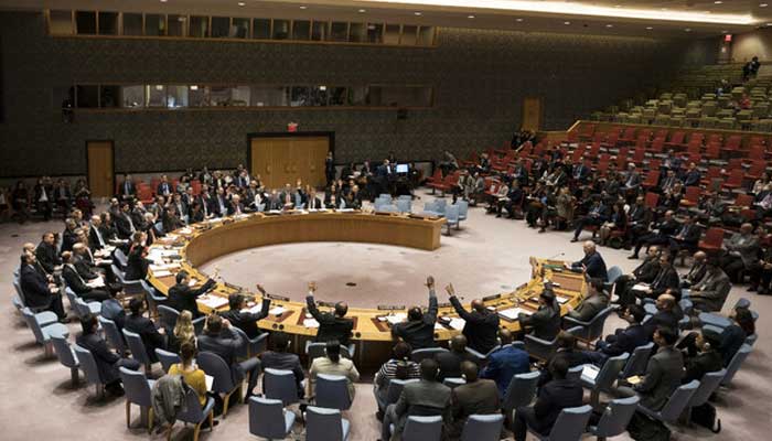 Members of the Security Council vote during a United Nations Security Council meeting on a ceasefire in Syria February 24, 2018 in New York. — AFP