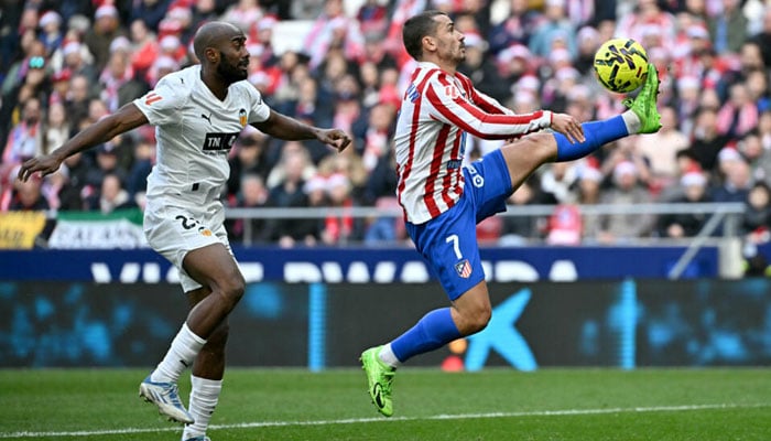 Atletico Madrids French forward Antoine Griezmann(left) in action. —AFP