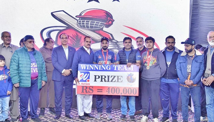 DSL Cricket Super League organiser Ahsan Bakhtawari (centre right) pose for a group photo with the winning team on December 13, 2025. — Facebook@shafaat.hussain