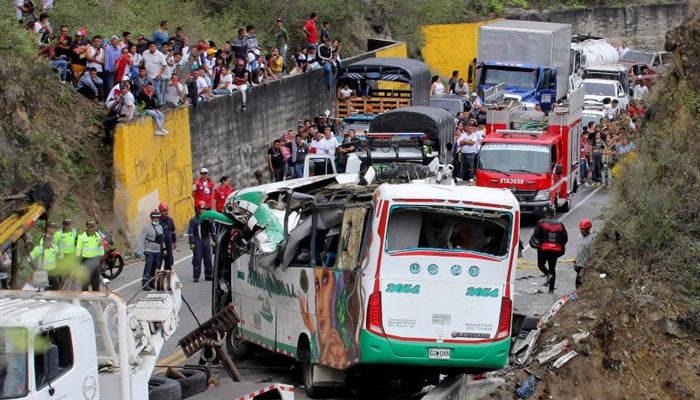 Rescuers are busy at a accident site. —AFP/File