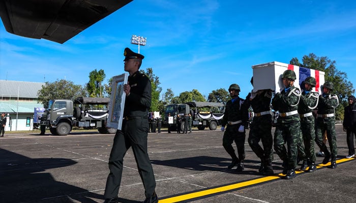 Military personnel carry the coffin of Private Mustageem Chema, covered by the Thai national flag, during a procession ceremony to transport bodies to their home town, at a military airport amid deadly clashes between Thailand and Cambodia along a disputed border area, in Ubon Ratchathani province, Thailand, December 14, 2025.—Reuters