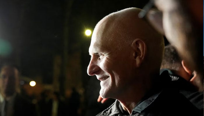 Ales Bialatski, prisoner released from Belarus, reacts as he arrives at the US embassy in Vilnius, Lithuania December 13, 2025.—Reuters