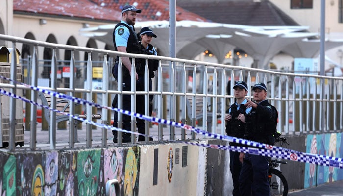 Police inspect at the scene of a shooting at Bondi Beach in Sydney on December 15, 2025. — AFP