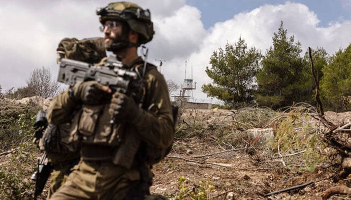 Israeli troops patrolling near a United Nations Interim Force In Lebanon (UNIFIL) base in the southern Lebanons Naqoura region near the border. —AFP/File