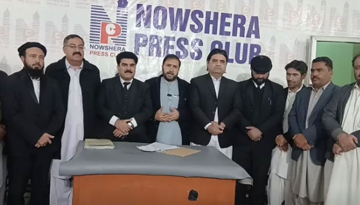 Nowshera Press Clubs president Hafiz Tafheemur Rehman (centre left) speaks after the annual elections year 2026 at the press club on December 15, 2025. — Screnegrab via Facebook@NowsheraPressClub