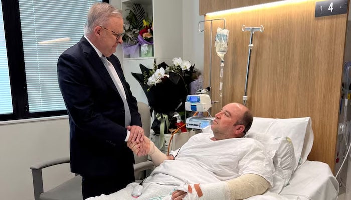 Australias Prime Minister Anthony Albanese visits Ahmed al Ahmed, the bystander who charged at one of the gunmen and seized his rifle during the deadly shooting at Bondi Beach, at St George Hospital in Sydney, Australia. —Reuters