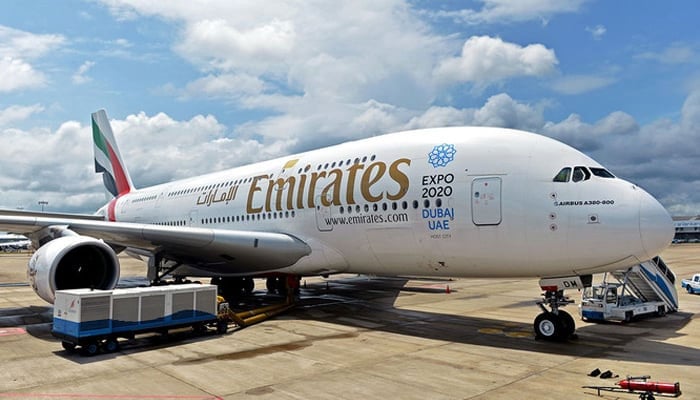 Emirates Airlines plane can be seen parked. — AFP/File