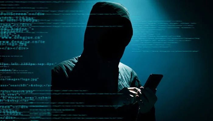 A representational image showing a person using a mobile phone as shades of coding appear of the left side. — AFP/File