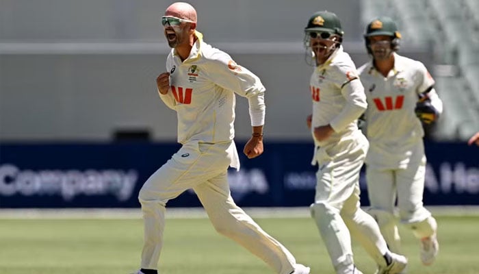 Nathan Lyon celebrates making history. —AFP/File