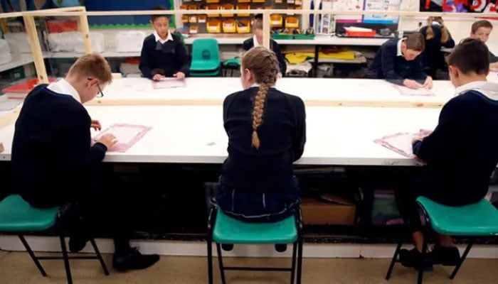 Children sit in a classroom at Heath Mount in Watton at Stone, the UK. — Reuters/File