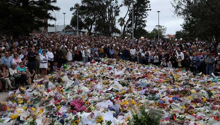 People lay flowers and pay tributes at Bondi Beach to honour the victims of a mass shooting that targeted a Jewish Holiday celebration on Sunday at Bondi Beach, in Sydney, Australia, December 16, 2025. — Reuters