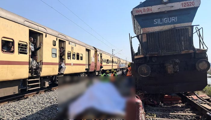Train passengers use their mobile phones to take photographs of a dead elephant after it was hit by a train in Hojai district in the eastern state of Assam, India, December 20, 2025.—Reuters