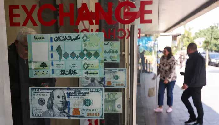 A man leaves a currency exchange shop in Sidon, Lebanon. — Reuters/File