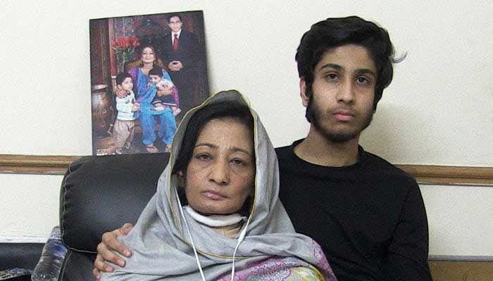 An undated photo of Shumaila Imran Farooq, the widow of slain senior MQM leader Dr Imran Farooq, along with her son. — Reporter