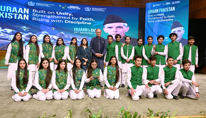 Federal Minister for Planning, Development and Special Initiatives, Professor Ahsan Iqbal Chaudhary, in a group photo with the participants of a ceremony marking the birth anniversary of the Founder of Pakistan, Quaid-e-Azam Muhammad Ali Jinnah, at the Convention Centre on December 25, 2025. — APP