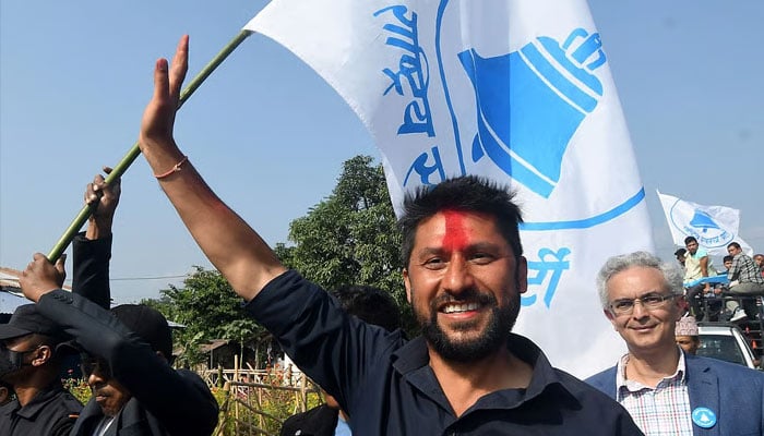 Former television host and Independent Party candidate in Nepal’s general election, Rabi Lamichhane, waves during an election campaign event. —AFP/File