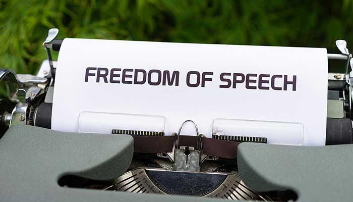 A typewriter displays the words Freedom of Speech in this representational image. — Unsplash