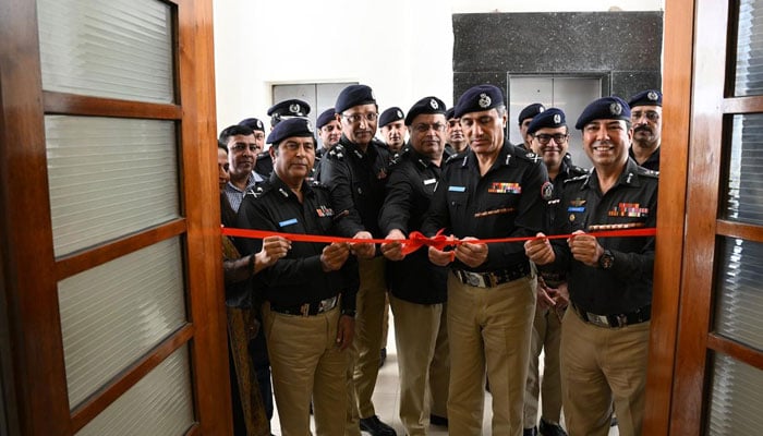 Sindh police chief Ghulam Nabi Memon cuts a ribbon to inaugurate a modern digital library at the Central Police Office Karachi on December 29, 2025. — Facebook@sindhpolicedmc
