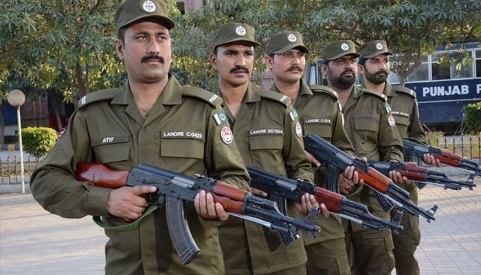 Punjab police soldiers standing alert. —APP/File