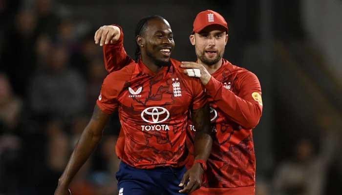 Jofra Archer of England celebrates with Will Jacks after catching out Marco Jansen of South Africa from his own bowling during the 2nd Vitality IT20 match between England and South Africa at Emirates Old Trafford on September 12, 2025 in Manchester, England. — ECB