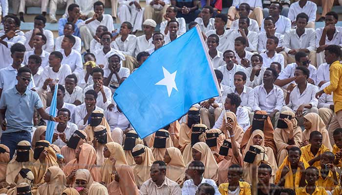 Residents wave Somali flags as they attend a rally denouncing Israels recent announcement recognising the breakaway Somaliland region, during a gathering calling for Somalias territorial unity at Mogadishu Stadium in Mogadishu on December 30, 2025. — AFP