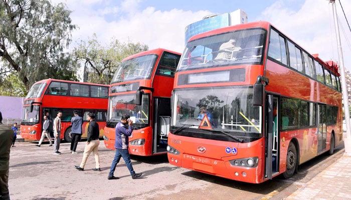 View of double-decker buses of Red Line Peoples Bus Service Project on its way to start the new route operation of buses after the inauguration ceremony of the Double-Decker Bus Service, in Karachi on December 31, 2025. — PPI